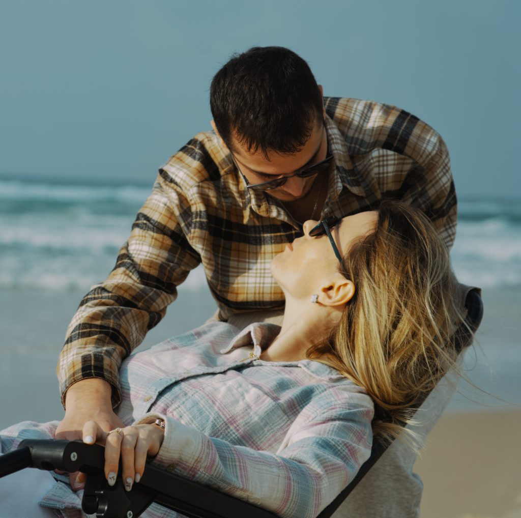 Beautiful young couple on the central beach of Bat Yam posing for a photo shoot